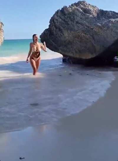 Devin Brugman running in the beach