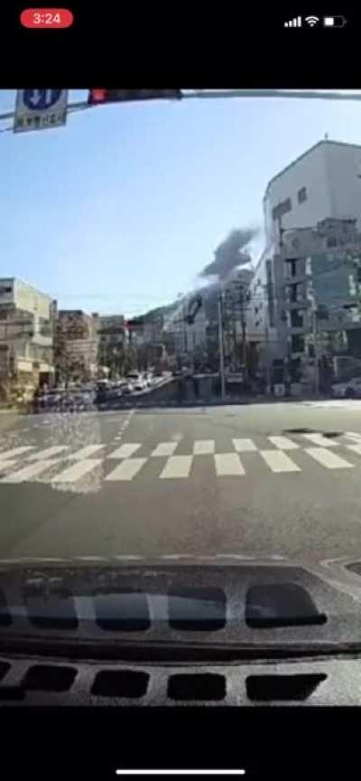 Car plummets off parking garage