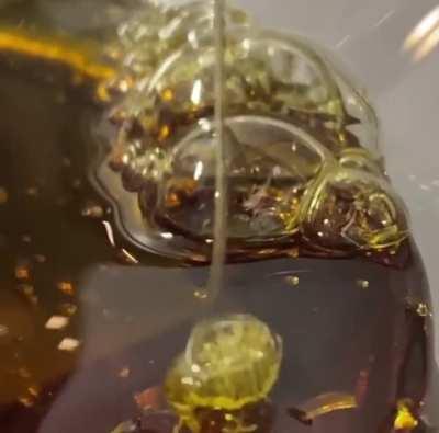This THC distillate drizzle is satisfying to watch
