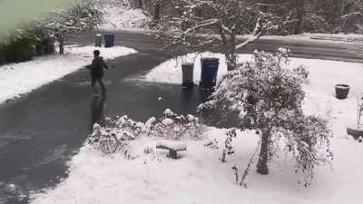 Person slides all the way down his driveway without falling