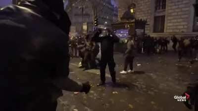 French protesters fighting against the police in order to liberate one of their member
