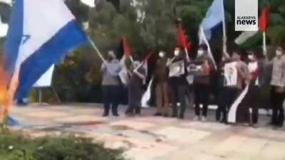 Raising the flag after putting it on fire.........