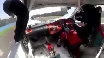 Race Car Driver Has Brush With Death When Debris Comes Crashing Through His Windshield