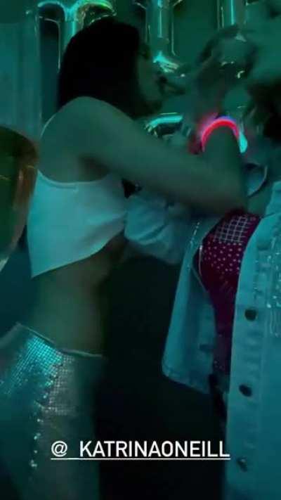 Katrina O'Neil subtlety lifts Lexi Wood's shirt