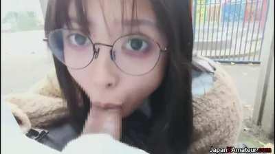 Amateur Japanese Girl With Glasses Deepthroating A Cock In A Park