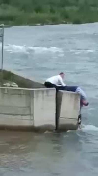 Guy went from wedding celebration to hep a dog.