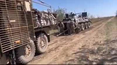 British MRAP Wolfhound 6x6 of Ukrainian paratroopers, towing a trophy BTR-82A, south.