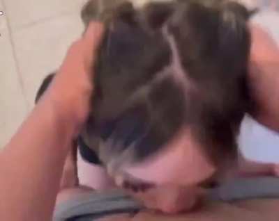 brunette takes his cock all the way down, steady and unflinching