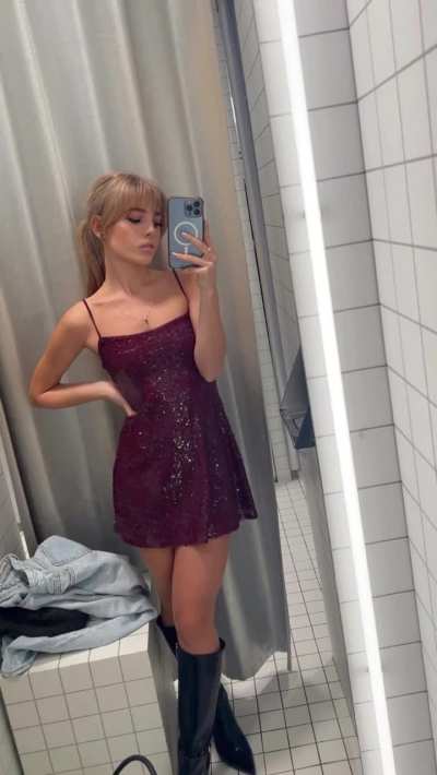 Charming Emily Linge takes a selfie in a burgundy mini dress and black knee-high boots 🌹🎄🎁