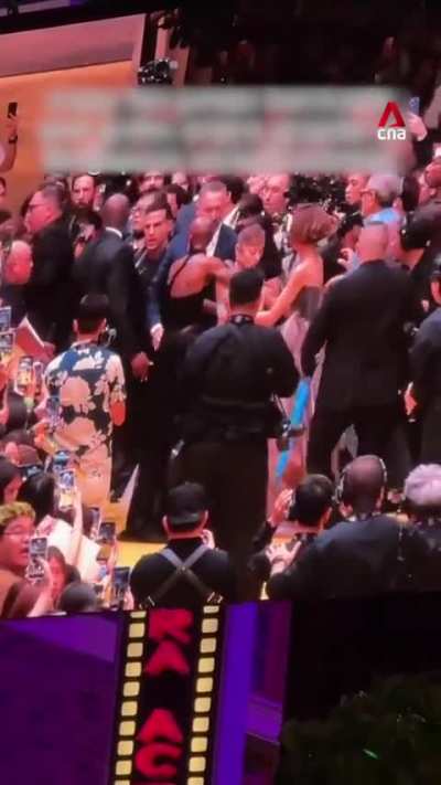 A fan jumped a barricade and rushed at Wicked star Ariana Grande in Singapore