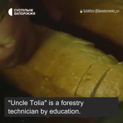 Uncle Tolia feeding the First Tank Artillery division. 