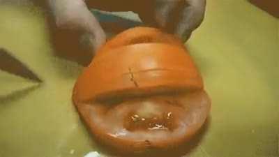 The most important part of jazzing up this tomato is hidden by the hand.