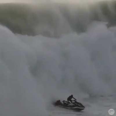 Jet ski driver saves a guy from a big wave