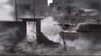 Iraqi Abrams tank from the 9th armored division provides support for emergency response division troops during the war on isis.