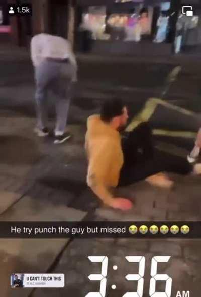 Dude throws a punch and misses by a mile