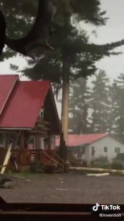 Lighting strikes a tree which then falls on a house. Volume warning.