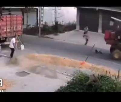 Kid almost gets wrecked by a tractor!
