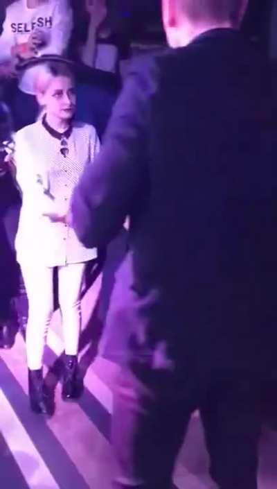 Undresses in public for money, covers up with a tiny towel. ENF