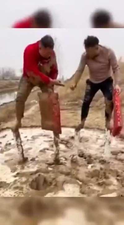 Playing rock paper scissors in mud