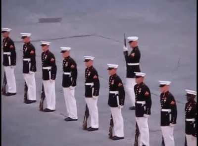 Marine misses rifle toss