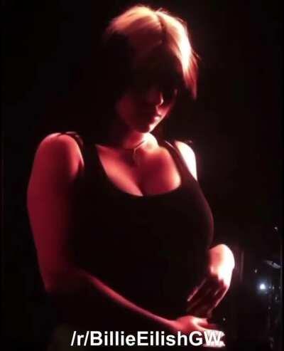 Putting her massive tits on display