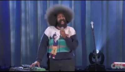 Reggie Watts using only his voice with a looping machine