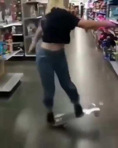 Taking a skateboard out on a shiny shop floor