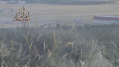 Two Opposition fighters launch a series of RPG attacks on a distant Syrian Army tank - 2013