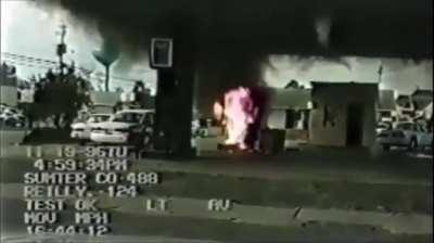 Cop causes crash at a gas station (Sumter County, SC) (Nov. 1996)