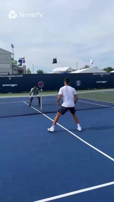 Alcaraz and Monfils having fun. And...Carlitos lost, so he had to do some push-ups.