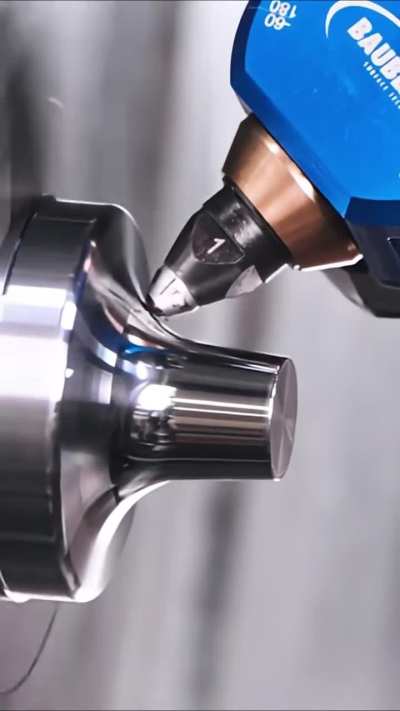 CNC diamond-tipped burnisher polishing a steel tool attachment