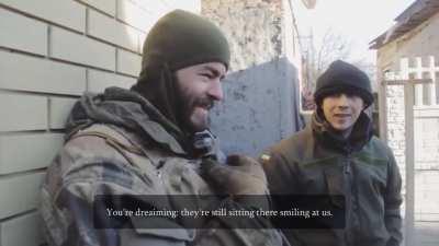 Ukrainian soldiers use an automatic grenade launcher as a mortar near Donetsk Airport.