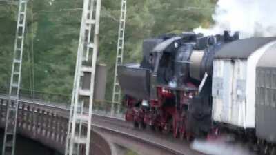 The Class 52 steam locomotive can go backwards as fast as forwards (80km/h). Deutschherrnbrücke, Frankfurt, Germany 2020