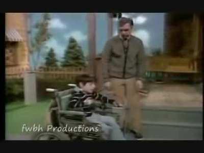 Fred Rogers ignores all ceremony and rushes the stage to say hi to his old friend