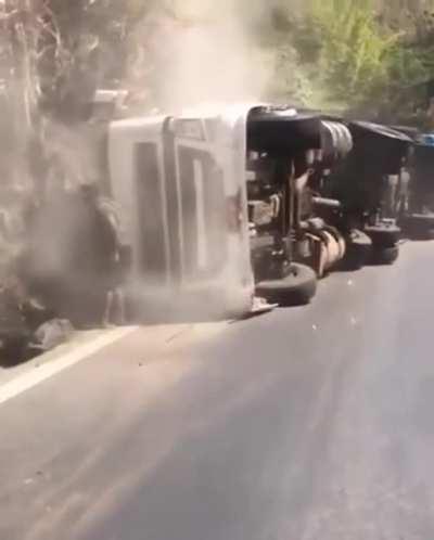WCGW speeding around a turn in a big truck (sign for sharp turn ahead is clearly visible)