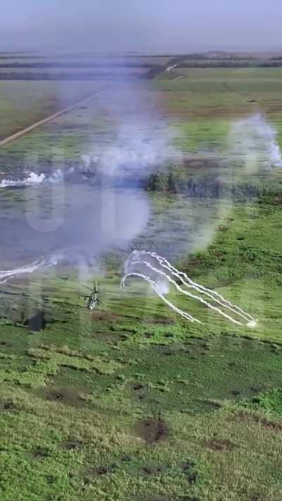 Over eastern Ukraine, a Ukrainian Mi-24 Hind helicopter nearly shoots down a friendly JTAC drone with a salvo of Hydra rockets. (reupload, messed the title up)