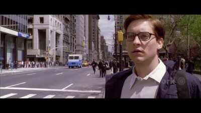 Joker runs past Spider-Man