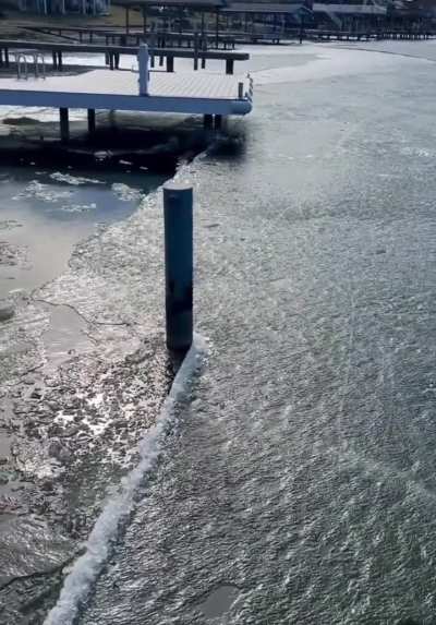 This illusion on a frozen lake. Looks like the pole is moving but it's actually the ice sheet