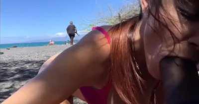 Naughty blowjob on public beach