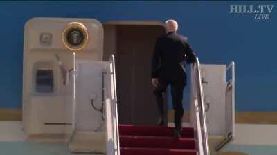 Biden trips climbing the steps of AF1
