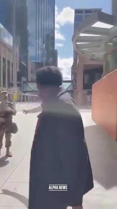 A would-be rioter confronts the National Guard