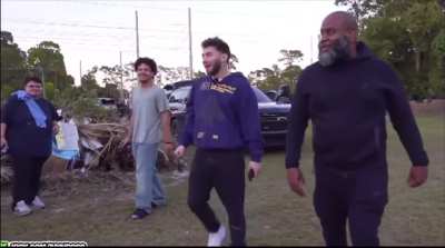 Guy shoots gun right by streamers feet. 