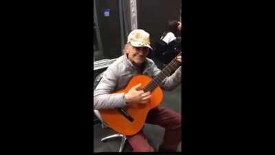 Talented Old man play western spaghetti with guitar and his mouth