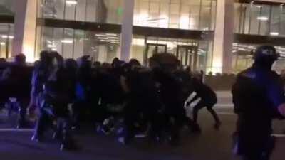 Portland police running into an antifa phalanx