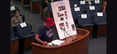 Protest of mask coverings at city council meeting devolves into song and bells