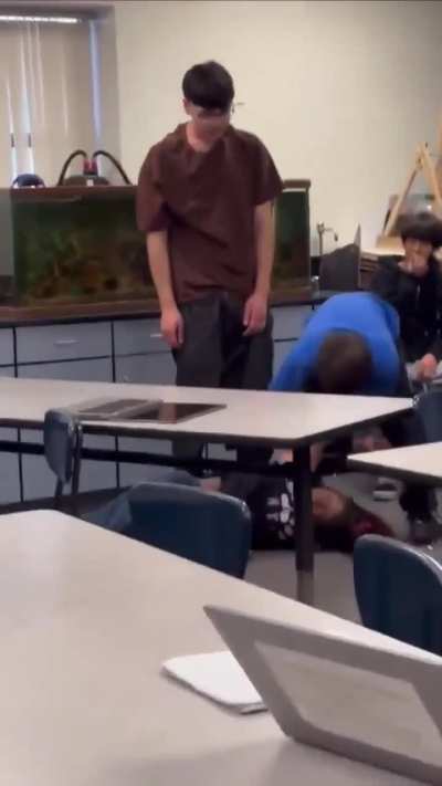 Guy Slams Girl’s Head On Desk and Knocks Her Out After She Keeps Coming At Him—Was It Too Much?