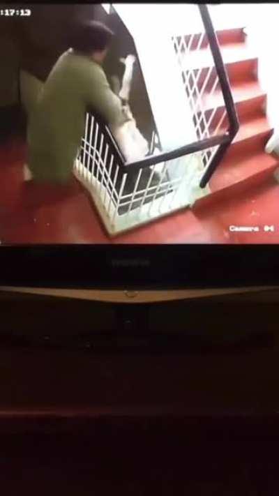 Dad saves his son from falling off the stairs gap