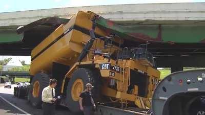Not paying attention to the height signs of upcoming bridges