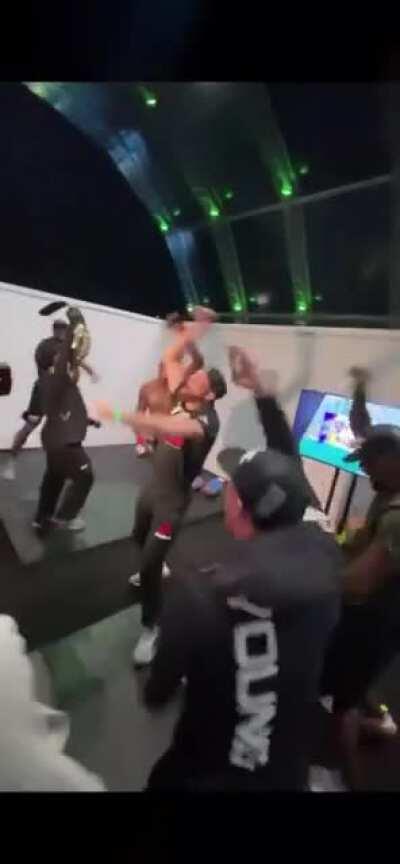 Israel Adesanya returns to the locker room after defended his UFC Middleweight Championship belt against Paulo Costa at UFC 253