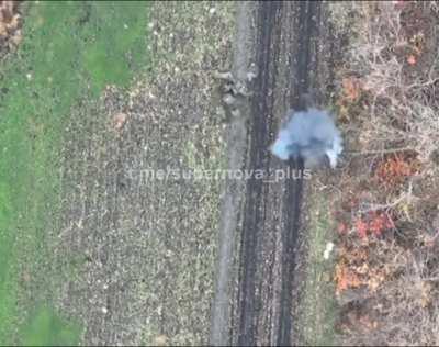 Ukrainian drone dropping explosive on Russian soldiers carrying their wounded on stretcher. Uploaded November 8th 2022